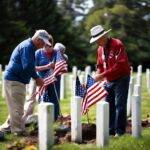 Honoring Fallen Veterans Lynnwood Volunteers Place Flags on Graves